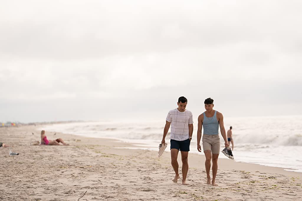 Guys are filming some girls on the beach